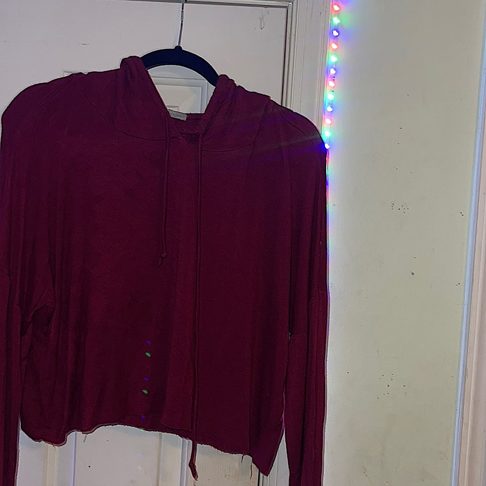 This is a marrom crop top hoodie